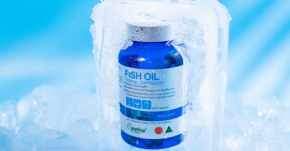 Close‑up of a blue bottle of fish oil omega‑3 softgel capsules, representing heart‑health supplements