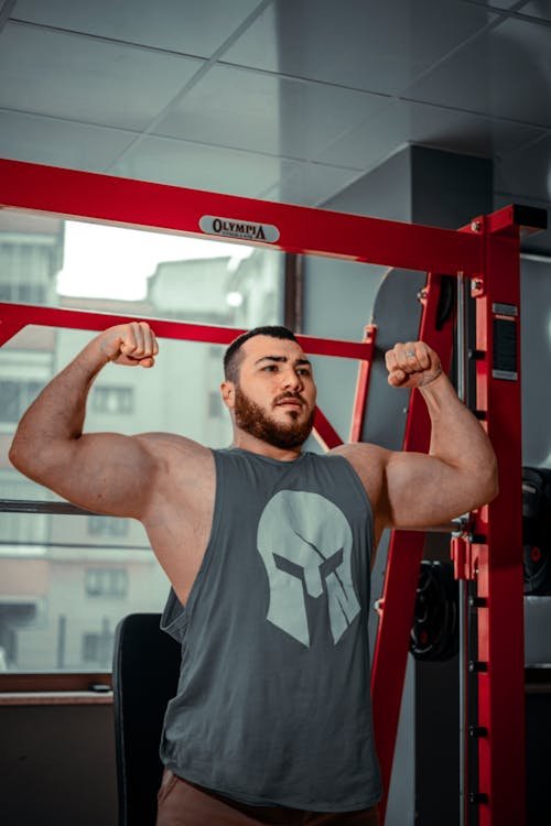 Person in sports clothing standing, representing strength training and post‑workout recovery