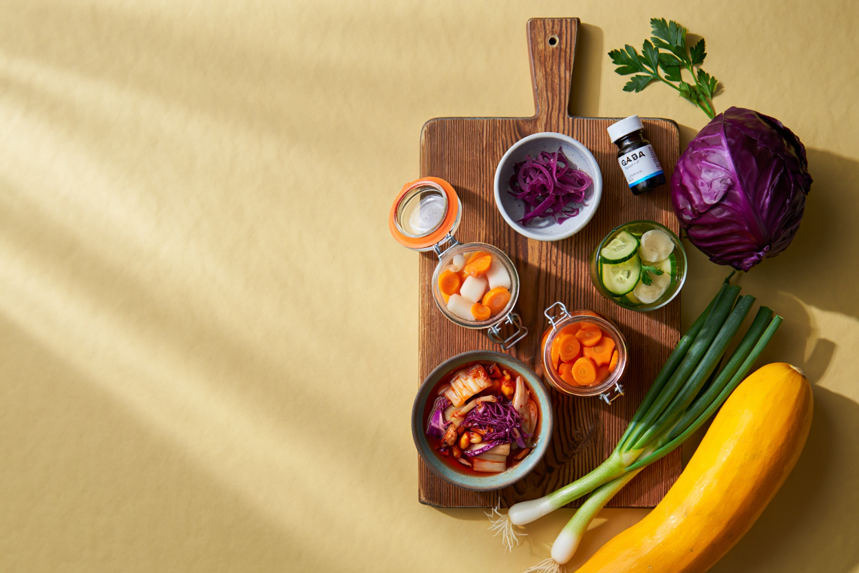 Array of fermented foods and GABA-rich vegetables including kimchi and spinach
